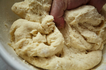 Kneading the dough for making cheburek