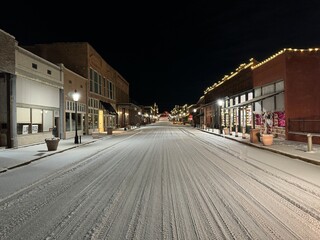 Downtown Van Buren Arkansas with snow covered Main Street.