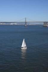San Francisco bridge, sailing yacht at port, white boat