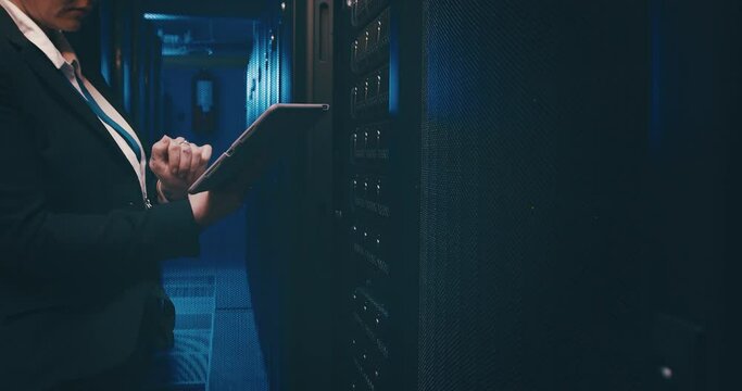 Person, tablet and server room for inspection, programming and coding of system solution and cybersecurity. Hands of technician on digital technology for hardware maintenance or data center at night