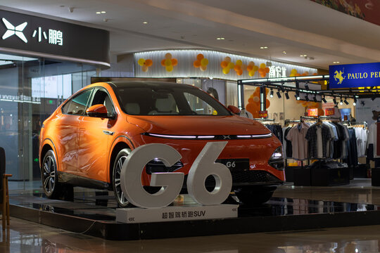 Ningbo, Zhejiang, China - Aug 2, 2023: XPeng G6 ultra smart coupe SUV is displayed outside its store in a shopping mall in Ningbo, China. XPeng Motors is a Chinese electric vehicle manufacturer.