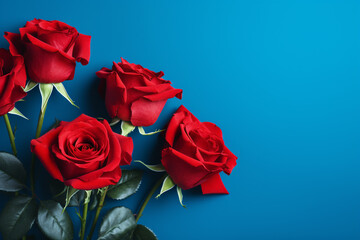 Red beautiful roses on blue background 
