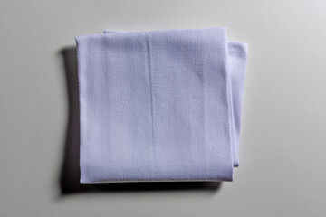 Top view of folded light blue napkin