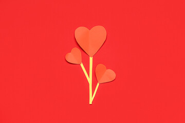Creative composition with paper hearts on red background. Valentine's day celebration