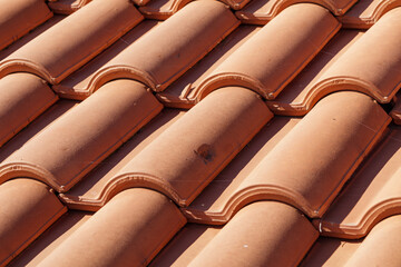 Clay tiles close-up. Orange clay tile roof, roof covering, roofing