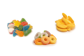 Assorted gummy candies isolated on a white background. Top view.