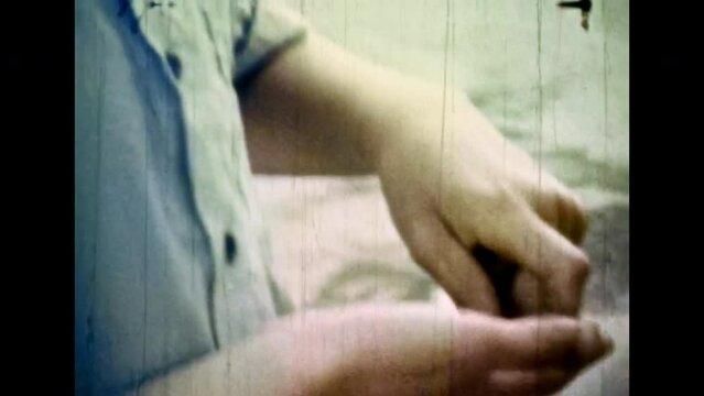 Close up, boy counting money in hands on city street. Teenage boy carefully count coins cash. Finance, economic kid knowledge concept. Cash savings. Vintage color film. Family archive. Retro 1980s
