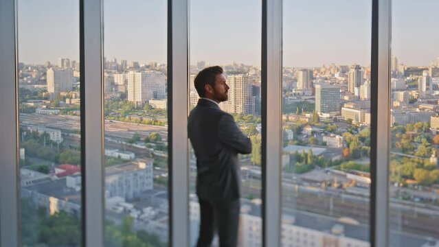 Man professional admire cityscape in modern office. Peaceful manager resting