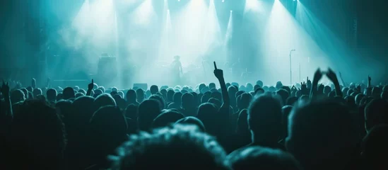Foto op Plexiglas an image of an audience in a concert © olegganko