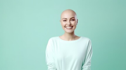 Headshot portrait of happy emotional bald girl on a mint background