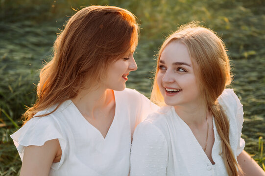 A woman looking at another woman in an outdoor setting 5685.