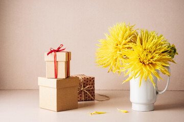 Yellow dahlias and gift boxes.