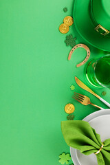 St. Patrick's Day Dining Elegance. Top view vertical shot of plates, cutlery, napkin, leprechaun...