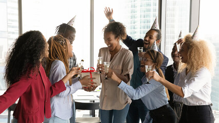 Best wishes. Multiethnic company staff congratulate black woman coworker with birthday promotion...
