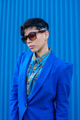 Young woman dressed in blue suit with androgenic hair style