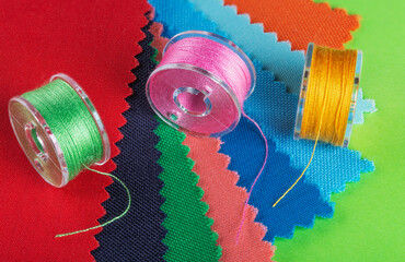 bobbins for a sewing machine with multi-colored threads.