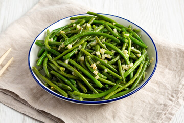 Homemade Asian Garlic Green Beans on a Plate, side view.