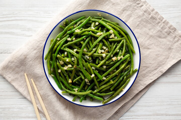 Homemade Asian Garlic Green Beans on a Plate, top view. Flat lay, overhead, from above.