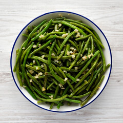 Homemade Asian Garlic Green Beans on a Plate, top view. Flat lay, overhead, from above.