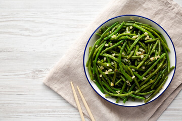 Homemade Asian Garlic Green Beans on a Plate, top view. Flat lay, overhead, from above.