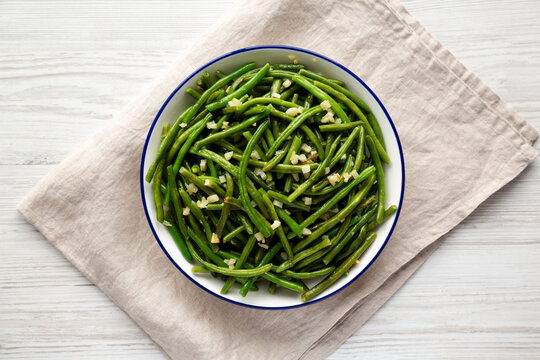 Homemade Asian Garlic Green Beans on a Plate, top view. Flat lay, overhead, from above.