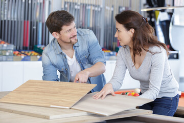 Fototapeta premium a couple choosing material for new apartment