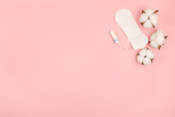 Tampon and sanitary pad on a pink background