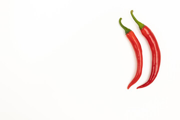 Red hot chili peppers on white