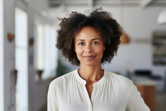 Afro-American Middle Aged Business Woman, Freelance Professional, Entrepreneur, Interior Designer Portrait. Black Woman Standing Inside Home Office, New House, Inside Modern White Room