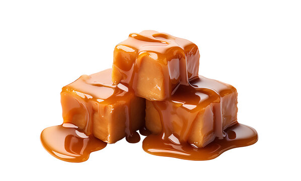 Sweet caramel candy cubes topped with caramel sauce on white background.