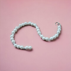Beautiful white pearl bracelet with pink background