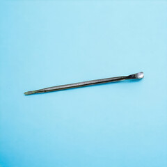 Electronic body prying tool on a blue background