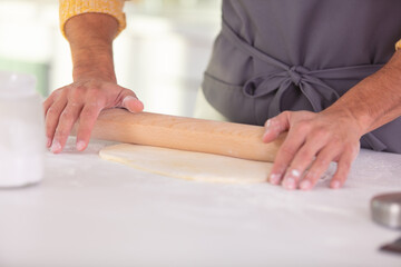 mans hands closeup kneading dough
