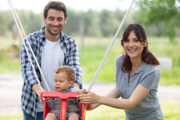 beautiful family in a sunny summer forest