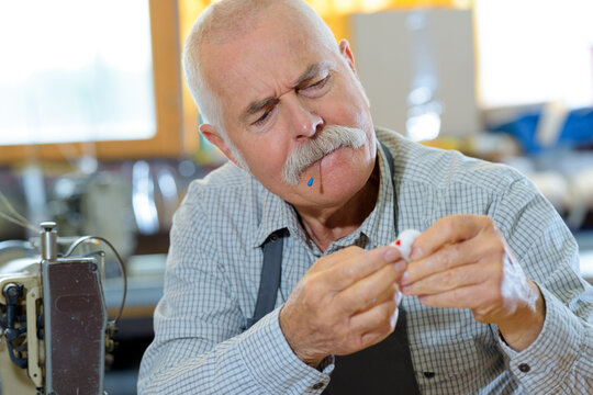 a senior tailor worker hurt himself