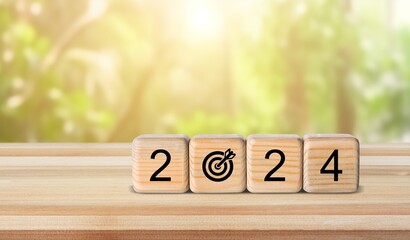 New Year 2024 goal plan. Wooden cubes with target icon