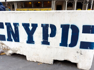 NYPD concrete road block on the sidewalk