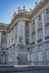 Architectural fragment of Spanish Royal Palace (Palacio Real, 18th century) in Madrid - official residence of the King of Spain, largest palace in Europe by floor area. Madrid, Spain.