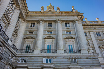 Fototapeta premium Architectural fragment of Spanish Royal Palace (Palacio Real, 18th century) in Madrid - official residence of the King of Spain, largest palace in Europe by floor area. Madrid, Spain.
