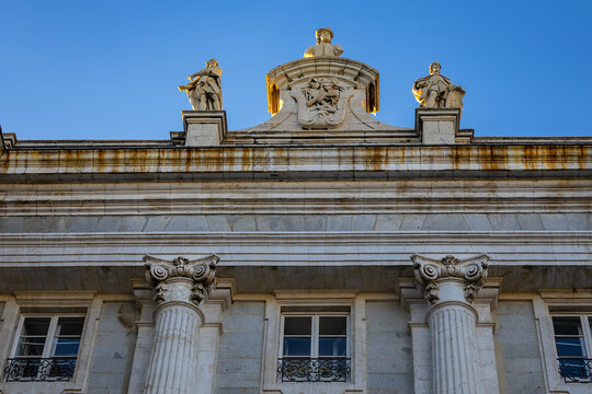 Architectural fragment of Spanish Royal Palace (Palacio Real, 18th century) in Madrid - official residence of the King of Spain, largest palace in Europe by floor area. Madrid, Spain.