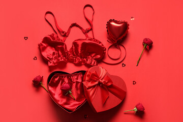 Composition with sexy lingerie, balloon and rose flowers on red background. Valentine's Day...