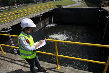 An advanced safety engineer inspects the wastewater system of the waterworks, and Maintenance for...