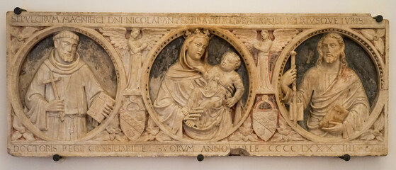 rectangular stone frame depicting saints in the monumental complex of San Lorenzo Maggiore...