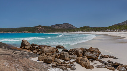 Fototapeta na wymiar Hellfire Bay with turquoise water, white sand and rocks in the foreground - Cape Le Grand National Park, Esperance, Western Australia