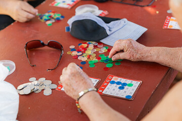 unrecognizable senior citizen playing bingo