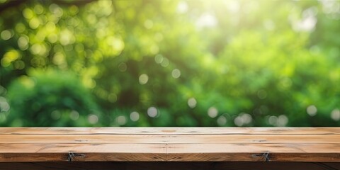 Wooden table with a blurred green backyard for an ad template.