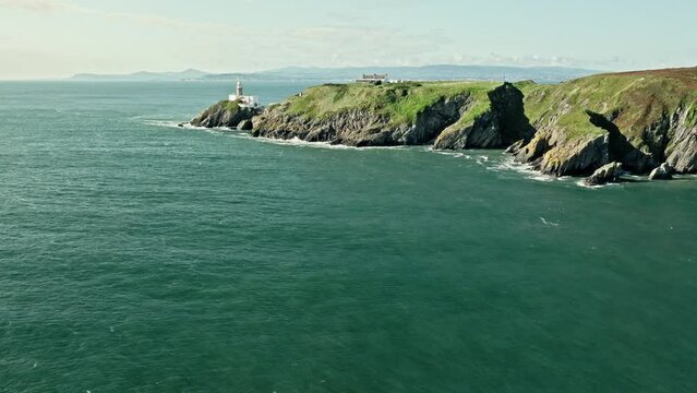 lighthouse on top of a cliff, landscape, aerial view