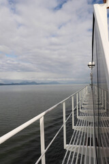 View of ocean and distant land from cruise ship