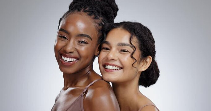 Women, beauty and skincare with laughing in studio with facial treatment, diversity or glowing skin. Friends, model and portrait with face for cosmetics, dermatology and support on gray background