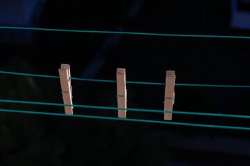 wooden clothespins on empty clotheslines